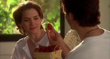 Movie still from “How to Make an American Quilt” (1995), directed by Jocelyn Moorhouse – A woman is holding a basket of strawberries; Close Up shot, Over the shoulder angle