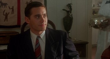 Movie still from “How to Make an American Quilt” (1995), directed by Jocelyn Moorhouse – A man in a suit and tie sitting in a chair; Medium shot, Over the shoulder angle
