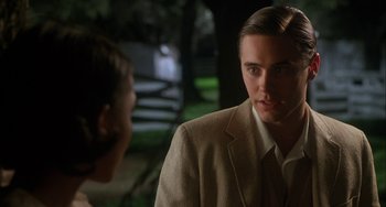 Movie still from “How to Make an American Quilt” (1995), directed by Jocelyn Moorhouse – A man in a tan suit talking to a woman; Close Up shot, Over the shoulder angle