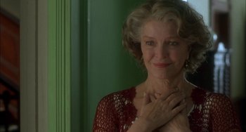 Movie still from “How to Make an American Quilt” (1995), directed by Jocelyn Moorhouse – An older woman is smiling with her hands on her chest; Close Up shot, Over the shoulder angle