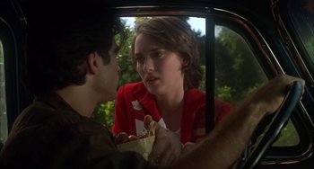 Movie still from “How to Make an American Quilt” (1995), directed by Jocelyn Moorhouse – A young man and a young woman in the back seat of a car; Close Up shot, Over the shoulder angle