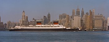 Movie still from “How to Marry a Millionaire” (1953), directed by Jean Negulesco – A cruise ship in the middle of a city; Extreme Wide shot, Low angle