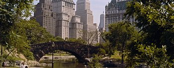 Movie still from “How to Marry a Millionaire” (1953), directed by Jean Negulesco – A bridge over a body of water in a city; Extreme Wide shot, High angle