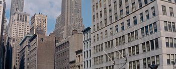 Movie still from “How to Marry a Millionaire” (1953), directed by Jean Negulesco – A view of some buildings in a city; Extreme Wide shot, Low angle