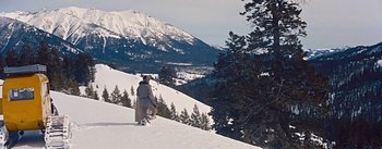 Movie still from “How to Marry a Millionaire” (1953), directed by Jean Negulesco – A person standing on top of a snow covered slope; Extreme Wide shot, High angle