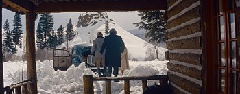 Movie still from “How to Marry a Millionaire” (1953), directed by Jean Negulesco – Two people are walking in the snow near a car; Wide shot, Low angle