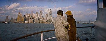 Movie still from “How to Marry a Millionaire” (1953), directed by Jean Negulesco – Two people look out over a body of water; Wide shot, High angle