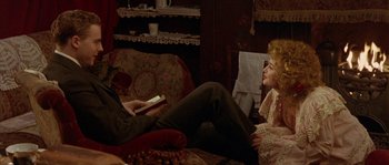 Movie still from “Howards End” (1992), directed by James Ivory – A man and a woman sitting on a couch; Medium shot, High angle