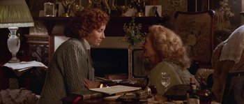 Movie still from “Howards End” (1992), directed by James Ivory – Two women sitting at a dining room table talking to each other; Medium shot, Over the shoulder angle