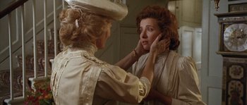 Movie still from “Howards End” (1992), directed by James Ivory – An older woman putting a necklace on a younger woman's neck; Close Up shot, Over the shoulder angle