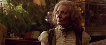 Movie still from “Howards End” (1992), directed by James Ivory – An older woman with long blonde hair wearing a white dress; Close Up shot, Low angle