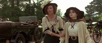 Movie still from “Howards End” (1992), directed by James Ivory – A woman in a black hat and a woman in a white top; Close Up shot, Low angle