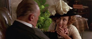 Movie still from “Howards End” (1992), directed by James Ivory – A man and a woman wearing hats and a suit; Close Up shot, Over the shoulder angle