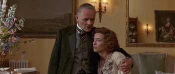 Movie still from “Howards End” (1992), directed by James Ivory – A man and a woman standing next to each other in a room; Close Up shot, Low angle