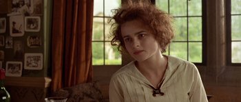 Movie still from “Howards End” (1992), directed by James Ivory – A young woman sitting in front of a window; Close Up shot, High angle