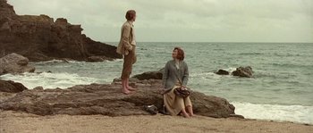 Movie still from “Howards End” (1992), directed by James Ivory – Two people on the beach by the water; Wide shot, Low angle