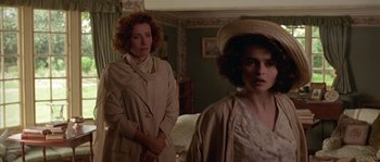 Movie still from “Howards End” (1992), directed by James Ivory – Two women standing next to each other in a room; Medium shot, Over the shoulder angle