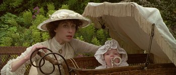 Movie still from “Howards End” (1992), directed by James Ivory – A woman and a baby sitting in a carriage; Close Up shot, High angle