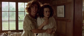 Movie still from “Howards End” (1992), directed by James Ivory – Two women are standing next to each other in a room; Medium shot, High angle