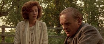 Movie still from “Howards End” (1992), directed by James Ivory – A man and a woman standing next to each other outside; Close Up shot, Over the shoulder angle