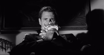 Movie still from “Hush...Hush, Sweet Charlotte” (1964), directed by Robert Aldrich – A black and white photo of a man eating a piece of pizza; Close Up shot, Low angle