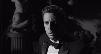 Movie still from “Hush...Hush, Sweet Charlotte” (1964), directed by Robert Aldrich – Black and white photograph of a man in a tuxedo; Close Up shot, Over the shoulder angle