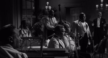 Movie still from “Hush...Hush, Sweet Charlotte” (1964), directed by Robert Aldrich – A black and white photo of a group of men in suits; Wide shot, High angle