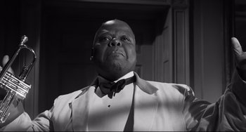 Movie still from “Hush...Hush, Sweet Charlotte” (1964), directed by Robert Aldrich – A black and white photo of a man in a tuxedo; Close Up shot, Low angle