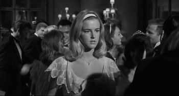 Movie still from “Hush...Hush, Sweet Charlotte” (1964), directed by Robert Aldrich – Black and white photograph of a woman in a crowd of people; Close Up shot, Over the shoulder angle