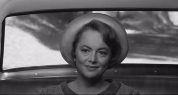 Movie still from “Hush...Hush, Sweet Charlotte” (1964), directed by Robert Aldrich – A black and white photo of a woman with a hat; Close Up shot, Low angle