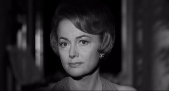 Movie still from “Hush...Hush, Sweet Charlotte” (1964), directed by Robert Aldrich – An old photo of a woman in a black and white photo; Close Up shot, Low angle