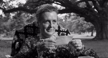 Movie still from “Hush...Hush, Sweet Charlotte” (1964), directed by Robert Aldrich – An older woman holding a piece of paper in her hands; Close Up shot, Low angle