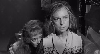 Movie still from “Hush...Hush, Sweet Charlotte” (1964), directed by Robert Aldrich – A woman and a woman standing next to each other in a room; Close Up shot, Over the shoulder angle