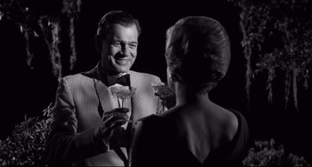 Movie still from “Hush...Hush, Sweet Charlotte” (1964), directed by Robert Aldrich – A black and white photo of a man and a woman; Medium shot, Over the shoulder angle