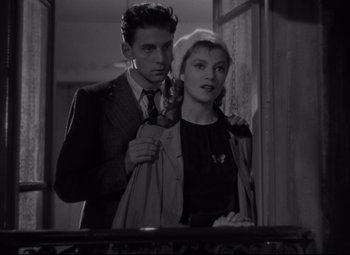 Movie still from “Hotel du Nord” (1938), directed by Marcel Carné – A man and a woman standing next to each other in a room; Medium shot, Low angle