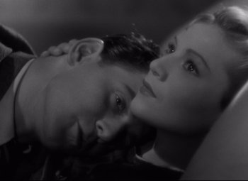 Movie still from “Hotel du Nord” (1938), directed by Marcel Carné – A man and a woman laying on top of each other; Close Up shot, High angle