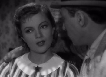 Movie still from “Hotel du Nord” (1938), directed by Marcel Carné – A man and a woman are looking at one another; Close Up shot, High angle