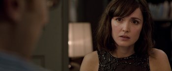 Movie still from “I Give It a Year” (2013), directed by Dan Mazer – A person wearing a dress; Close Up shot, Over the shoulder angle