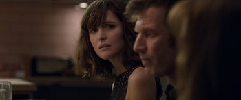 Movie still from “I Give It a Year” (2013), directed by Dan Mazer – A woman and a man sitting next to each other in a room; Close Up shot, Over the shoulder angle