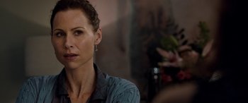 Movie still from “I Give It a Year” (2013), directed by Dan Mazer – A person sitting in a room; Close Up shot, Over the shoulder angle