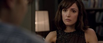 Movie still from “I Give It a Year” (2013), directed by Dan Mazer – A person wearing a dress; Close Up shot, Over the shoulder angle