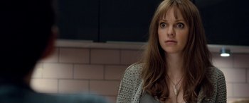 Movie still from “I Give It a Year” (2013), directed by Dan Mazer – A person with long brown hair; Close Up shot, Over the shoulder angle