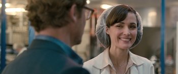 Movie still from “I Give It a Year” (2013), directed by Dan Mazer – A man and a woman smiling at each other; Close Up shot, Over the shoulder angle