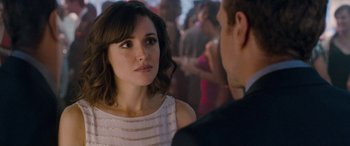 Movie still from “I Give It a Year” (2013), directed by Dan Mazer – A man and a woman talking in front of each other; Close Up shot, Over the shoulder angle