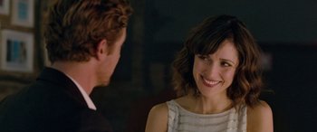 Movie still from “I Give It a Year” (2013), directed by Dan Mazer – A man and a woman are smiling at each other; Close Up shot, Over the shoulder angle