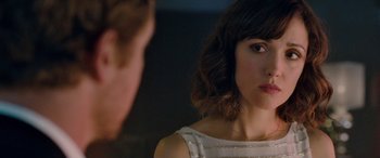 Movie still from “I Give It a Year” (2013), directed by Dan Mazer – A person looking at a mirror; Close Up shot, Over the shoulder angle