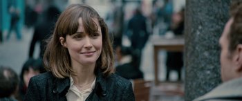 Movie still from “I Give It a Year” (2013), directed by Dan Mazer – A person wearing a jacket; Close Up shot, Over the shoulder angle