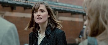 Movie still from “I Give It a Year” (2013), directed by Dan Mazer – A person wearing a jacket; Close Up shot, Over the shoulder angle