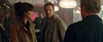 Movie still from “I Give It a Year” (2013), directed by Dan Mazer – A man and a woman standing in front of a crowd; Medium shot, Over the shoulder angle