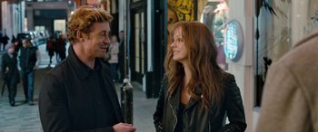 Movie still from “I Give It a Year” (2013), directed by Dan Mazer – A man and a woman talking on the sidewalk; Medium shot, Over the shoulder angle